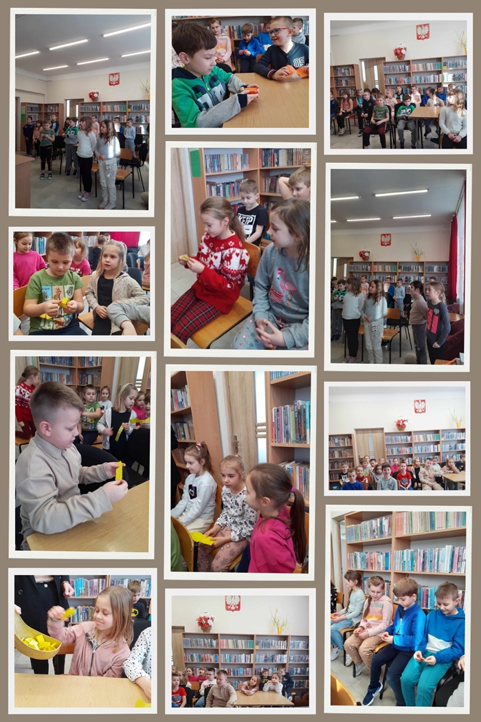  Uczniowie klas pierwszych w bibliotece szkolnej podczas pasowania na czytelnika.